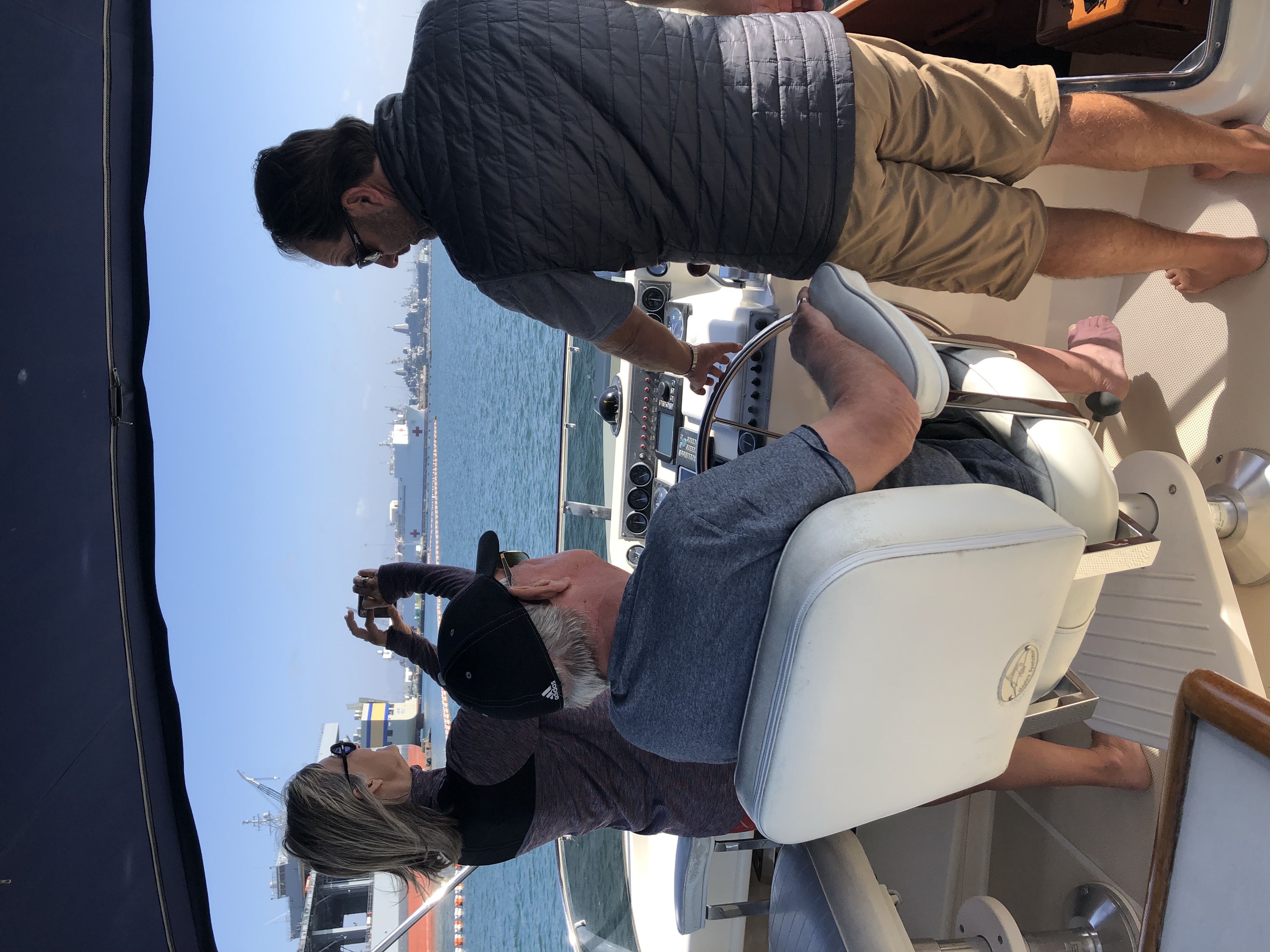 A couple learns to captian their own boat with the help of a powerboating instructor in the San Diego harbor.