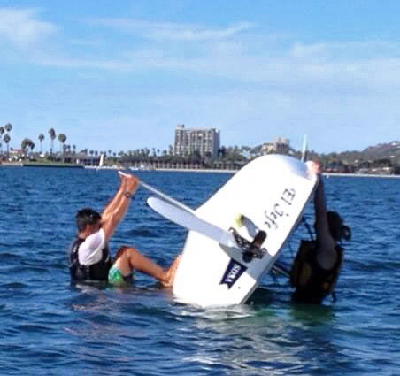 UCSD Sailing Team fixing a capsized boat