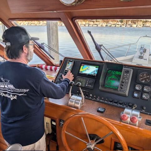 Mike at helm of Prairie Girl